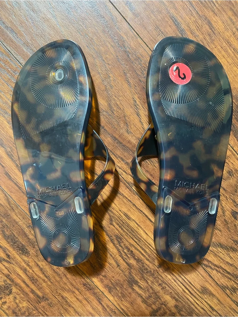 Michael Kors Tortoiseshell Logo Jelly Thong Sandals in Brown and Black